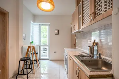 a kitchen with a sink and a counter top at Central Sofia Gem by Vitoshka Street in Sofia