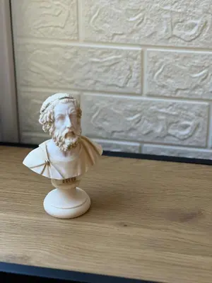 a statue of a bust of a man on a table at Kolev Apartment in Sofia