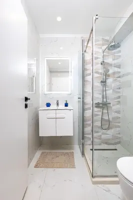 a white bathroom with a shower and a sink at Casa Moderna - Stylish 1BD in South Plovdiv by Flat Manager in Plovdiv