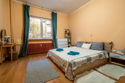 a bedroom with a bed and a window at Charming Central Retreat! in Sofia