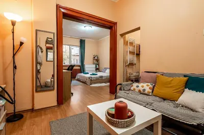 a living room with a couch and a table at Charming Central Retreat! in Sofia