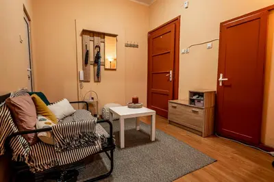 a living room with a couch and a table at Charming Central Retreat! in Sofia