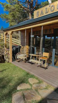 a porch of a sa cabin with swings at Villa INDIANA Devin in Devin