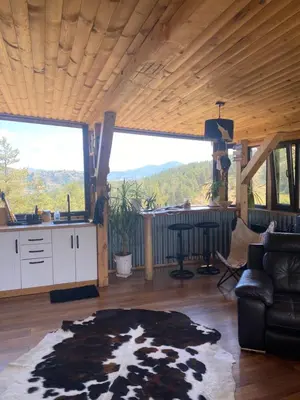 a living room with a kitchen and a large window at Villa INDIANA Devin in Devin