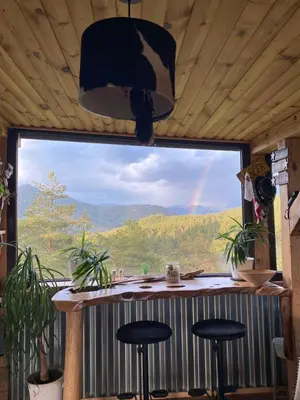 a room with a large window with a view of a rainbow at Villa INDIANA Devin in Devin