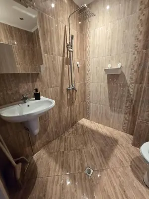 a bathroom with a sink and a shower at Happy Home in Sofia