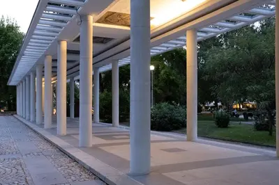 a row of white columns on a walkway at 5 Villa Vitosha Classic Stays in Hisarya