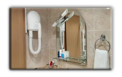 a bathroom with a shower and a phone on the wall at Studio Resonance Bansko in Bansko