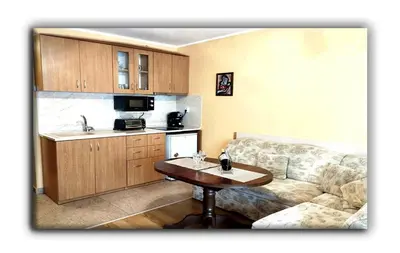 a living room with a couch and a table at Studio Resonance Bansko in Bansko