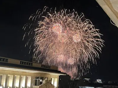 a firework display in the sky over a building at Superbe last floor next Presidency in Sofia