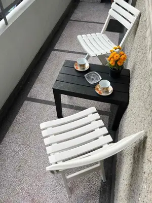 two white chairs and a table on a balcony at Central Vintage Apartment for 4 Guests & Private Parking in Plovdiv