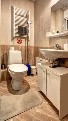 a bathroom with a toilet and a sink at River Apartment in Sofia