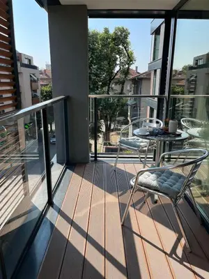 a balcony with a table and chairs on it at Апартамент в сърцето на ПЛОВДИВ in Plovdiv