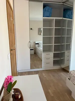 a bedroom with a large mirror and a bed at Апартамент в сърцето на ПЛОВДИВ in Plovdiv