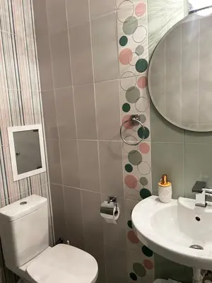 a bathroom with a toilet and a sink at Rea Flora - Cozy Stay With Free Parking in Sofia