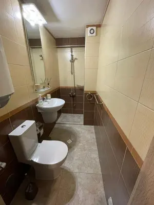 a bathroom with a toilet and a sink at Premium Nomad's Suite-Near Subway-Terrace in Sofia