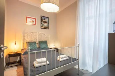 a baby crib in a room with aaning at Urban Oasis Heaven in Sofia