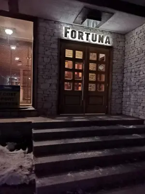 a front door of a forino store with stairs in front at Топ локация! in Bansko
