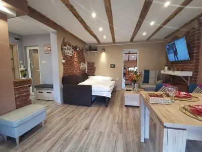 a living room with a bed and a couch in a room at D1 LOFT-Top center with free parking in Sofia
