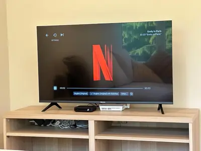 a flat screen tv sitting on top of a tv stand at Park Apartment in Sofia