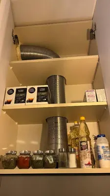 a shelf in a kitchen with various items on it at Cosy apartment 11Mins Center in Plovdiv