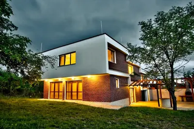 a house is lit up at night at Villa Dream in Dobrevtsi