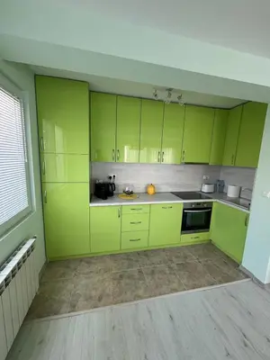 a kitchen with lime green cabinets in a room at Contemporary Comfort in Lozenets in Sofia