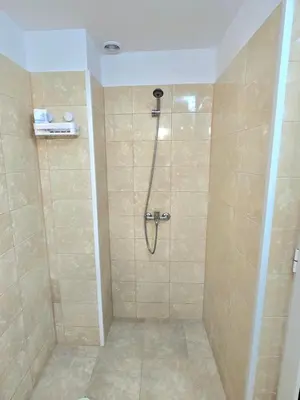 a bathroom with a shower with a shower at Стаи за гости ЖиВел in Oreshak