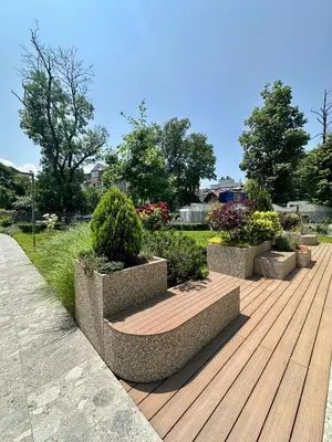 a row of planters on a wooden deck at The Skyline Residence Sofia in Sofia