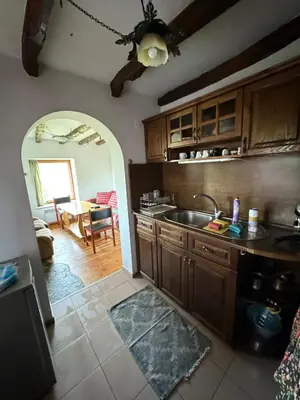 a kitchen with a sink and a table in a room at Guest House in Rhodope Mountains in Rudozem