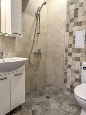 a bathroom with a shower and a sink at 1BR Apartment with Panoramic View Balcony and Designated Parking Space in Plovdiv
