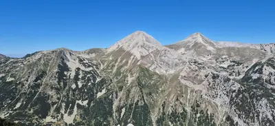 a mountain range with a blue sky in the background at Gondola luxury apartment 2 in Bansko