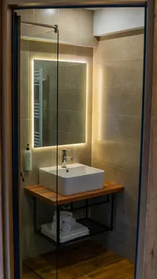 a bathroom with a sink and a mirror at Villa Veranda in Smolyan