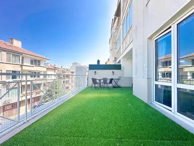 a balcony with green grass on a building at Stylish 1BD Apt in Lozenets with large balcony by Flat Manager in Sofia