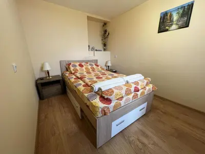 a bedroom with a bed in a room at Villa Geshevi in Hisarya