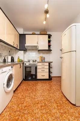 a kitchen with a washer and a refrigerator at Spacious 2BR Apt Kremena 10 minutes walk to Center in Plovdiv