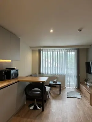 a kitchen with a desk with a chair and a microwave at Приказна гледка B5 2 in Borovets
