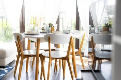 a dining room with a white table and chairs at Mall of Sofia - UrbanLux Ampla 2BDR FREE Parking in Sofia