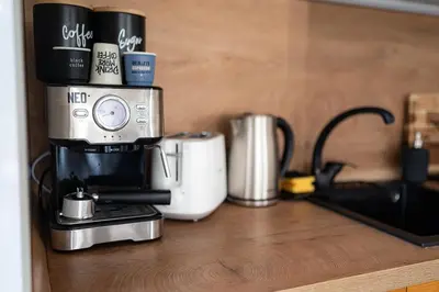 a coffee maker sitting on top of a counter at Mall of Sofia - UrbanLux Ampla 2BDR FREE Parking in Sofia