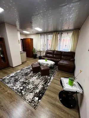 a living room with a couch and a rug at Complex Koko Hills in Sapareva Banya