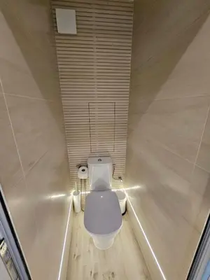 a bathroom with a toilet in a room at Apartment Home in Troyan