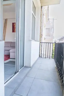 a balcony with a view of a couch at Sofia Downtown Apartment in Sofia