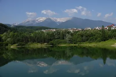 a view of a lake with mountains in the background at 19 Rose in Bansko