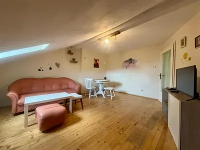 a living room with a couch and a table at Quiet and Lovely 2 BDRM loft in the Old Centre in Sofia