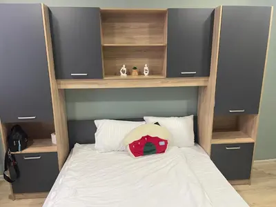a bedroom with a bunk bed with two speakers at GuestHouse Karma369 in Plovdiv