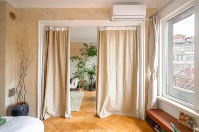 a bedroom with a bed and a large window at TERRA Design - Award-Winning Apartment - by Flat Manager in Sofia