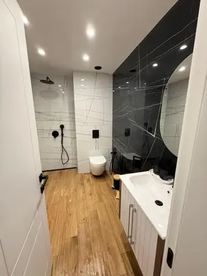 a bathroom with a sink and a toilet in it at The Giraffe's apartment in Sofia