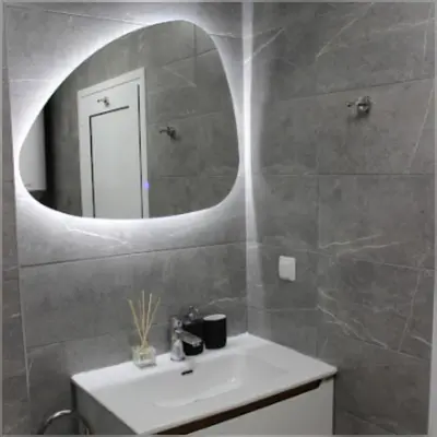 a bathroom with a sink and a mirror at Candy 26 Apartment in Velingrad