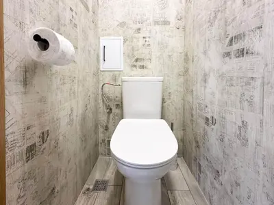 a bathroom with a toilet and a roll of toilet paper at 2 Apartments, 2 Parking - Sleeps 8 - Quiet Central in Sofia
