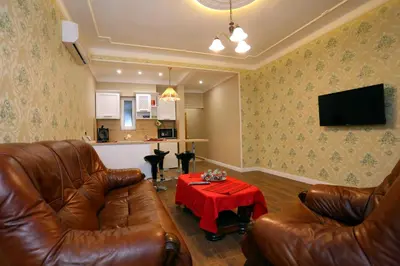 a living room with two leather couches and a table at Apartment in Sofia Centre by Flat Manager in Sofia